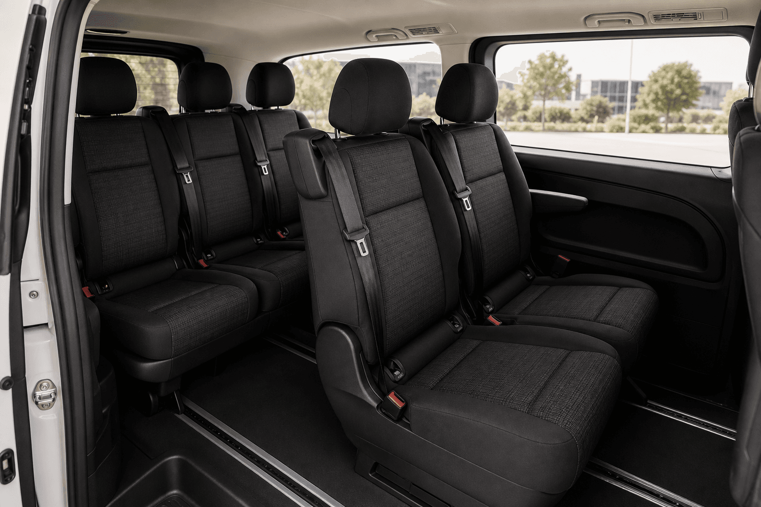 Clean black fabric passenger interior of a Mercedes Vito van
